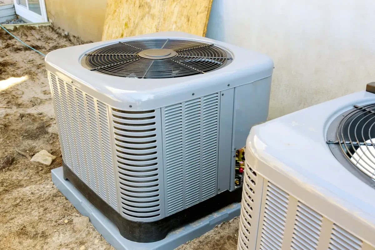 Two outdoor air conditioner condensers